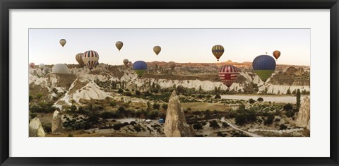 Framed Mulit colored hot air balloons at sunrise over Cappadocia, Central Anatolia Region, Turkey Print