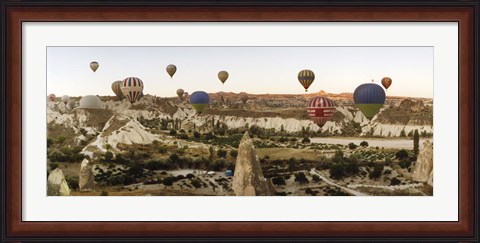 Framed Mulit colored hot air balloons at sunrise over Cappadocia, Central Anatolia Region, Turkey Print