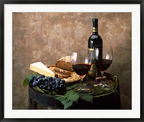 Framed Still life of wine bottle, wine glasses, cheese and purple grapes on top of barrel Print