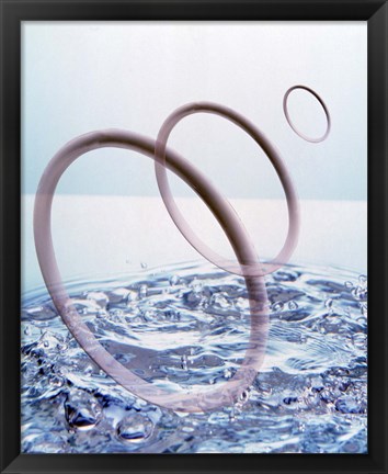 Framed Three opaque white circles floating away from churning water Print