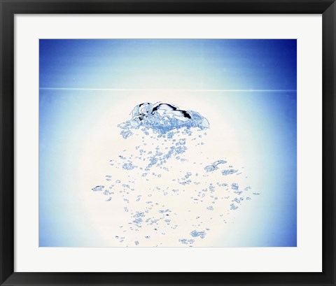 Framed Churning bubbles rising upwards with bright light background Print