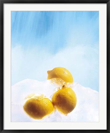 Framed Three lemons frozen in ice below ice blue sky Print