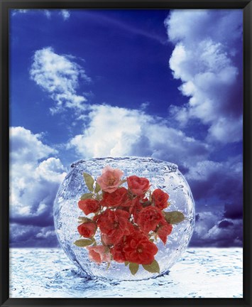 Framed Crystal round vase filled with ice and red roses resting on seashore with blue sky and white clouds Print