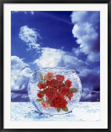 Framed Crystal round vase filled with ice and red roses resting on seashore with blue sky and white clouds Print