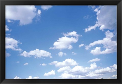 Framed Cumulus Clouds Against a Bright Blue Sky Print