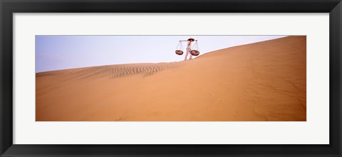 Framed Low angle view of a woman carrying panniers, Mui Ne, Vietnam Print