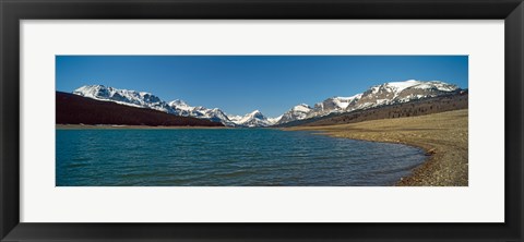 Framed Lake with snow covered mountains in the background, Sherburne Lake, US Glacier National Park, Montana, USA Print