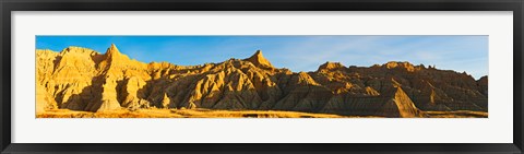 Framed Rock formations on a landscape in golden light, Saddle Pass Trail, Badlands National Park, South Dakota, USA Print