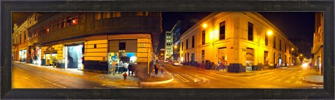 Framed Shops along a street at night, Lima, Peru Print