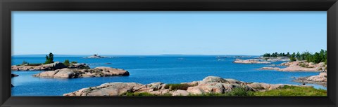 Framed Rock formations in a lake, Killarney, Georgian Bay, Ontario, Canada Print