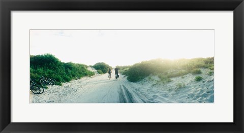 Framed Rear view of a couple cycling along a beach trail, Fort Tilden, Queens, New York City, New York State, USA Print