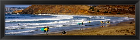 Framed Surfers on the beach, California, USA Print