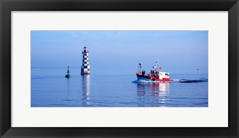 Framed Les Perdrix lighthouse and fishing boat at Loctudy, Brittany, France Print