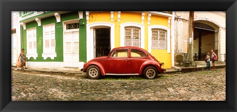 Framed Small old red car parked in front of colorful building, Pelourinho, Salvador, Bahia, Brazil Print