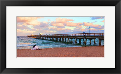 Framed Couple sitting on the beach at sunset, Fort Lauderdale, Florida, USA Print