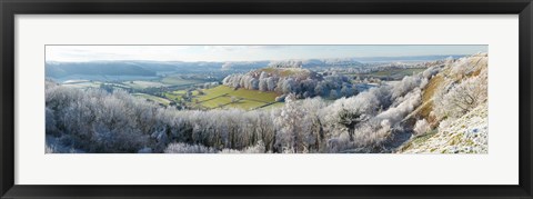 Framed Snow covered trees in a valley from Uley Bury, Downham Hill, Gloucestershire, England Print