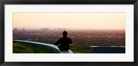 Framed Man sting on the ledge in Baldwin Hills Scenic Overlook Park, Culver City, Los Angeles County, California, USA Print