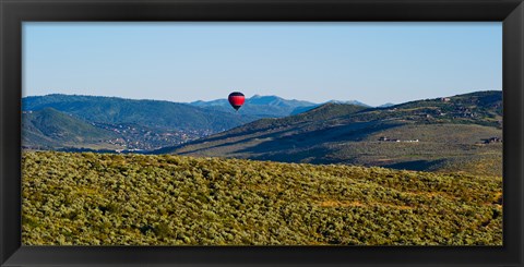 Framed Hot air balloon flying in a valley, Park City, Utah, USA Print