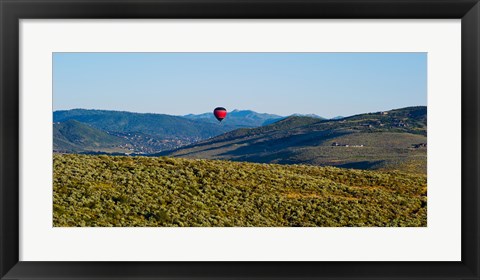 Framed Hot air balloon flying in a valley, Park City, Utah, USA Print