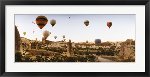 Framed Hot air balloons over landscape at sunrise, Cappadocia, Central Anatolia Region, Turkey Print