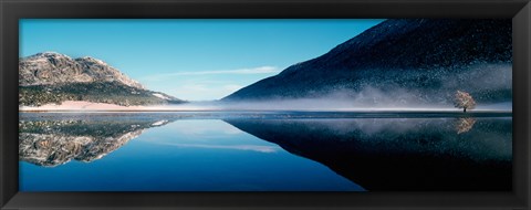 Framed Reflection of a mountain with snowy trees on a lake in winter afternoon, Cote d&#39;Azur, France Print