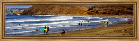 Framed Surfers on the beach, California, USA Print