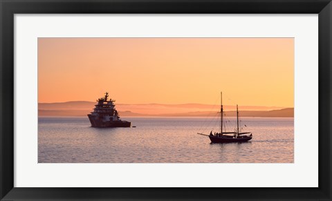 Framed Tugboat and a tall ship in the Baie de Douarnenez at sunrise, Finistere, Brittany, France Print