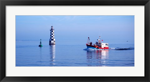 Framed Les Perdrix lighthouse and fishing boat at Loctudy, Brittany, France Print