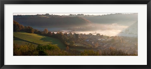 Framed Misty morning valley with village, Uley, Gloucestershire, England Print