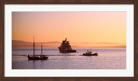 Framed Tugboat with a trawler and a tall ship in the Baie de Douarnenez at sunrise, Finistere, Brittany, France Print