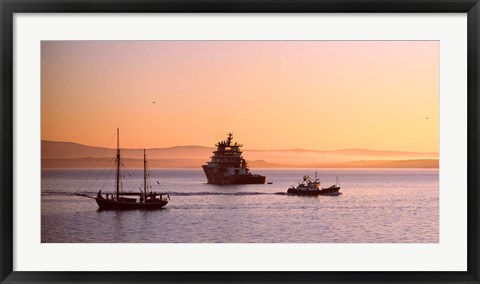 Framed Tugboat with a trawler and a tall ship in the Baie de Douarnenez at sunrise, Finistere, Brittany, France Print