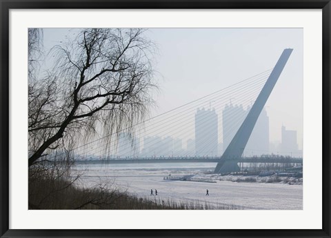 Framed Songhuajiang Highway Bridge over the frozen Songhua River with buildings in the background, Harbin, Heilungkiang Province, China Print