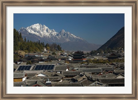 Framed High angle view of houses with Jade Dragon Snow Mountain in the background, Old Town, Lijiang, Yunnan Province, China Print