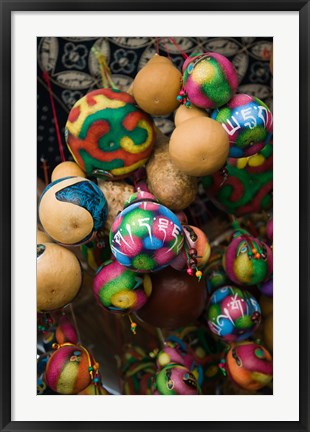 Framed Painted gourds for sale in a street market, Old Town, Lijiang, Yunnan Province, China Print