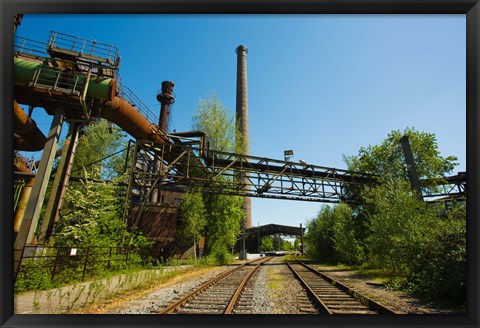 Framed Railroad tracks passing through an old steel mill, North Duisburg Landscape Park, Ruhr, North Rhine Westphalia, Germany Print