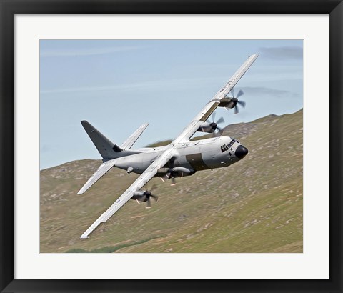 Framed C-130J Super Hercules low flying over North Wales on a training flight Print