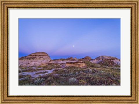 Framed Gibbous moon and crepuscular rays over Dinosaur Provincial Park, Canada Print