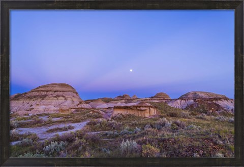 Framed Gibbous moon and crepuscular rays over Dinosaur Provincial Park, Canada Print