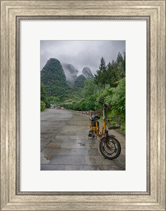 Framed Bicycle sits in front of the Guilin Mountains, Guilin, Yangshuo, China Print