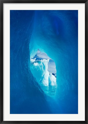 Framed Antarctica, Iceberg framed in arch of another in Wilhelmina Bay. Print