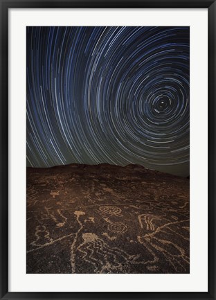 Framed Star trails at an ancient petroglyph site near Bishop, California Print