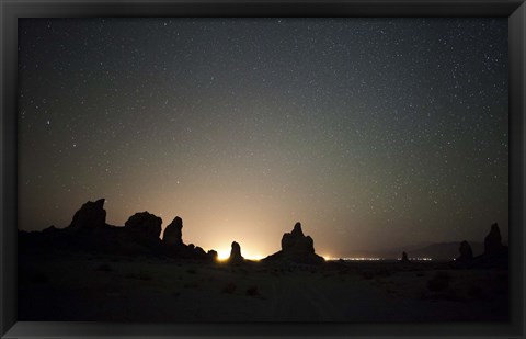 Framed Large tufa formations at Trona Pinnacles against a backdrop of stars Print