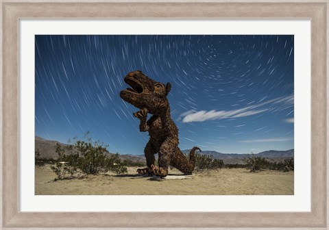 Framed Tyrannosaurus rex sculpture against a backdrop of star trails, California Print