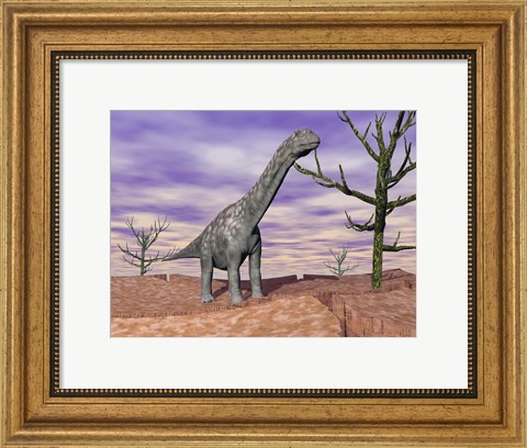 Framed Argentinosaurus standing on the cracked desert ground next to dead trees Print