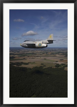 Framed Saab J 29 jet fighter flying over landscape Print