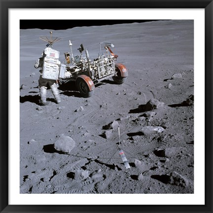 Framed Astronaut walking near the lunar rover on the moon, Apollo 16 Print