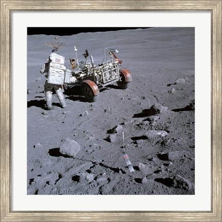 Framed Astronaut walking near the lunar rover on the moon, Apollo 16 Print