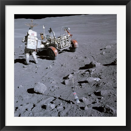 Framed Astronaut walking near the lunar rover on the moon, Apollo 16 Print