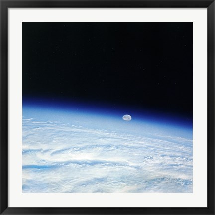 Framed Outer space shot of storm system in early stage of formation with moon in background Print