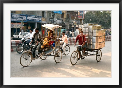 Framed People and cargo move through streets via rickshaw, Varanasi, India Print